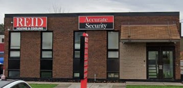 36 Capital Drive, Nepean — the Home Service Group building, with Reid Heating & Cooling and Accurate Security signage on the brick front