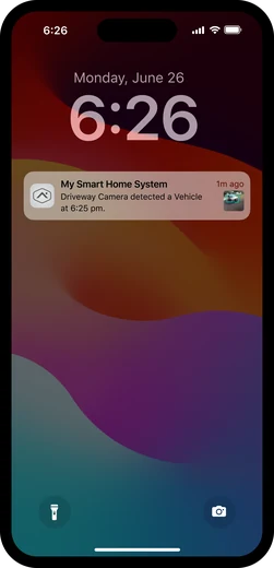 Alarm.com app notification showing a person detected in the driveway