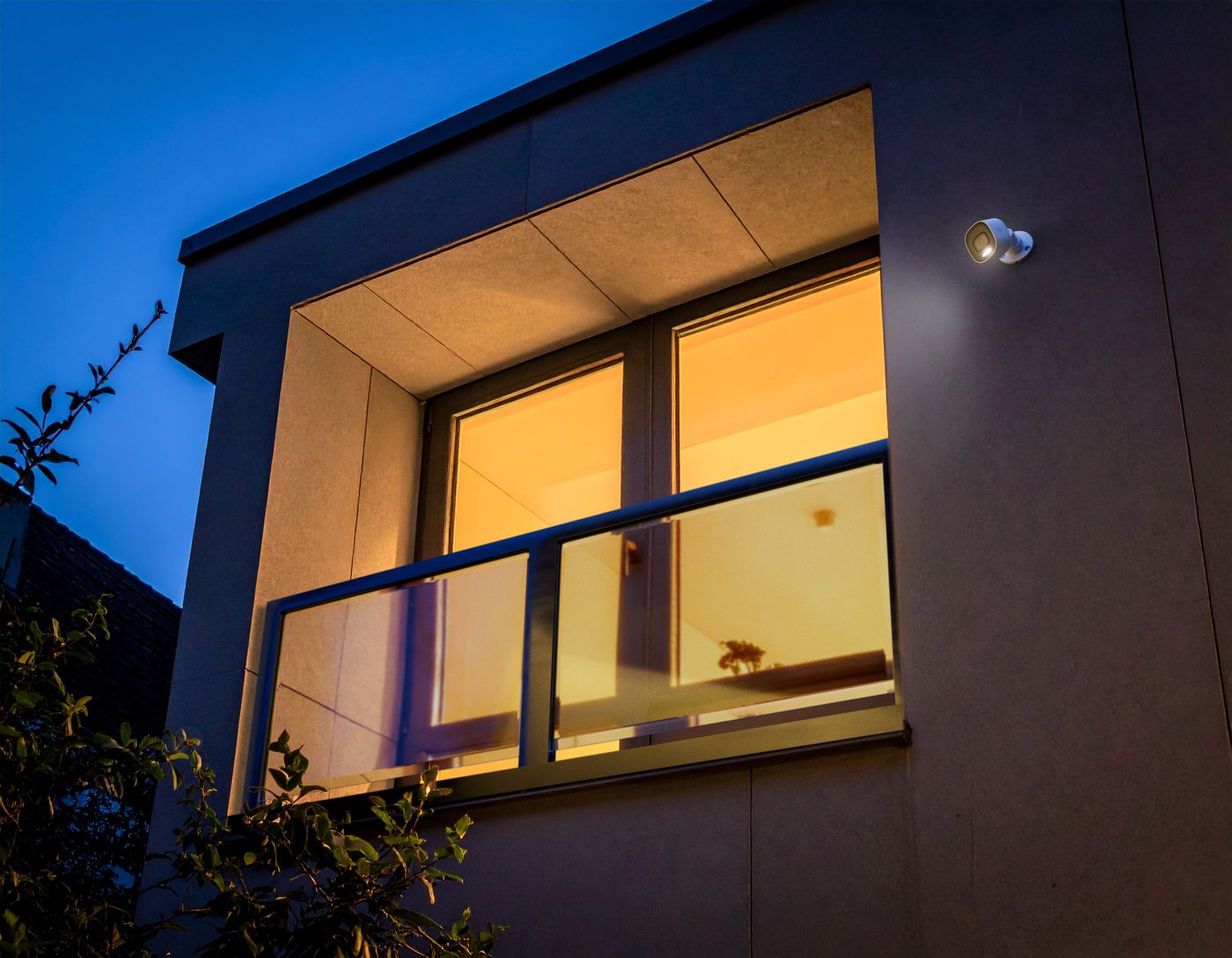 Alarm.com VC730P camera lighting a home exterior at night