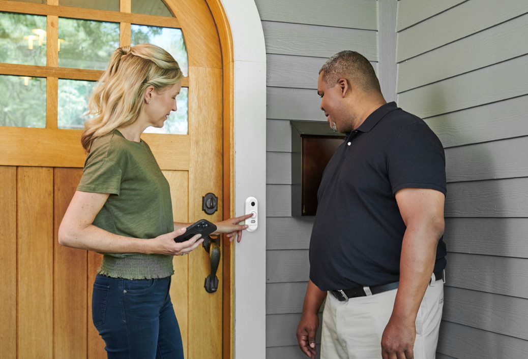 Family arriving home protected by their security system