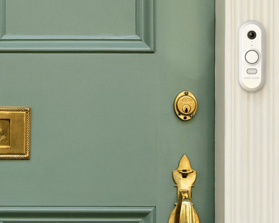 First Alert VX1 video doorbell installed beside a front door